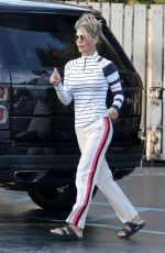 LORI LOUGHLIN at a Gas Dtation to Put Air in the Tire in Los Angeles 10/13/2022