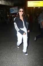 SUNNY LEONE Arrives at Airport in Mumbai 10/12/2022