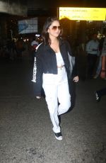 SUNNY LEONE Arrives at Airport in Mumbai 10/12/2022