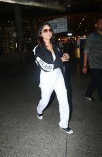 SUNNY LEONE Arrives at Airport in Mumbai 10/12/2022