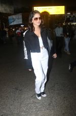 SUNNY LEONE Arrives at Airport in Mumbai 10/12/2022