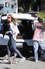 CHRISHELL STAUSE Loading a New Guitar into the Trunk of Her Car in Studio City 11/15/2022