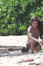 CLARA BERRY in Bikini Picking the Trash from the Beach in Tulum 11/19/2022