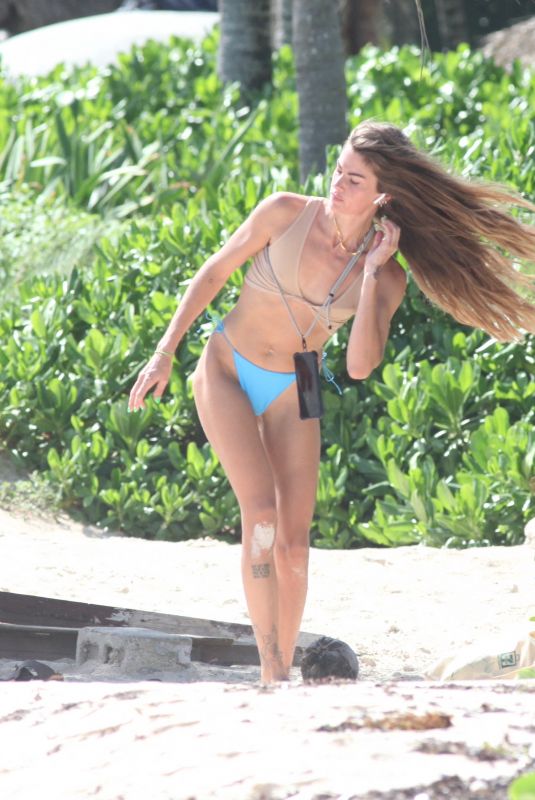 CLARA BERRY in Bikini Picking the Trash from the Beach in Tulum 11/19/2022