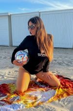 CLAUDIA ROMANI in a World Cup Long Sleeve Shirt and Bikini Bottoms at a Beach in Miami 11/27/2022