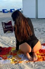 CLAUDIA ROMANI in a World Cup Long Sleeve Shirt and Bikini Bottoms at a Beach in Miami 11/27/2022