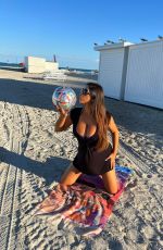 CLAUDIA ROMANI in Bikini at a Beach in Miami 11/17/2022