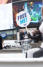 FAYE WINTER Poses for Orcas in a Bathtub in Piccadilly Circus in London 11/18/2022