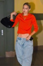 GIGI HADID in a Baggy Denim and Red Top Out in New York 11/18/2022