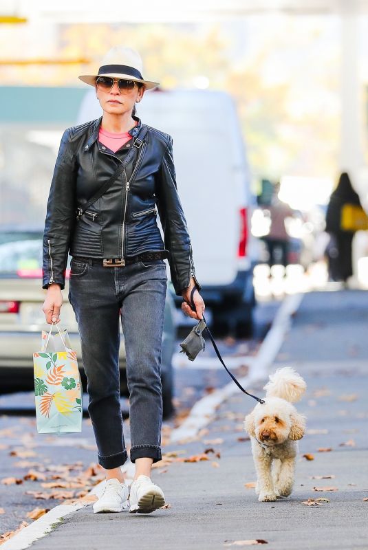 JULIANNA MARGUILES Out Shopping with Her Dog in New York 04/11/2022