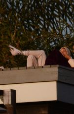 KELLY GALE and Joel Kinnaman Watch Sunset From a Rooftop in Los Angeles 11/22/2022