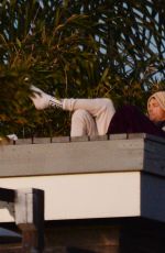 KELLY GALE and Joel Kinnaman Watch Sunset From a Rooftop in Los Angeles 11/22/2022