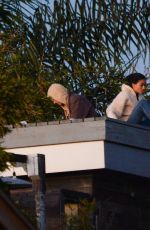 KELLY GALE and Joel Kinnaman Watch Sunset From a Rooftop in Los Angeles 11/22/2022