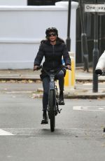 LAUREN SILVERMAN and Simon Cowell at a Bike Ride Around a Park in London 11/23/2022