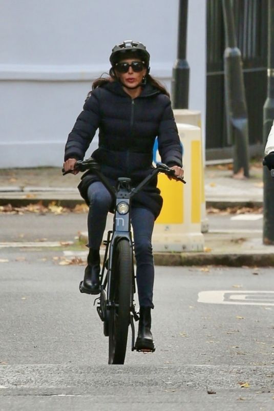 LAUREN SILVERMAN and Simon Cowell at a Bike Ride Around a Park in London 11/23/2022