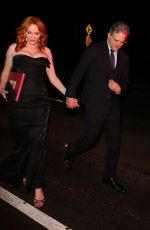 CHRISTINA HENDRICKS and George Bianchini Arrives at a Holiday Party in Brentwood 12/03/2022
