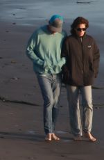 CINDY CRAWFORD and Rande Gerber Out for a Beach Walk in Malibu 12/19/2022