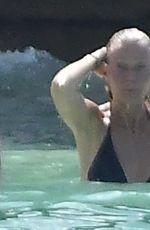 GWYNETH PALTROW and APPLE MARTIN in Bikinis at a Beach in Barbados 12/24/2022