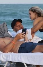 JOY CORRIGAN in Bikini at a Beach in Miami 12/03/2022
