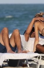 JOY CORRIGAN in Bikini at a Beach in Miami 12/03/2022