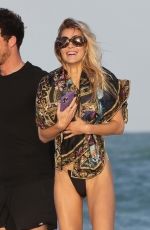 JOY CORRIGAN in Bikini at a Beach in Miami 12/03/2022