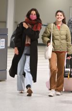 KATIE HOLMES and SURI CRUISE Arrives at Newark Airport in New Jersey 12/27/2022
