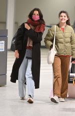 KATIE HOLMES and SURI CRUISE Arrives at Newark Airport in New Jersey 12/27/2022