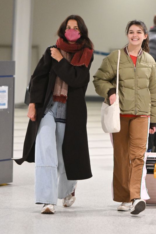 KATIE HOLMES and SURI CRUISE Arrives at Newark Airport in New Jersey 12/27/2022