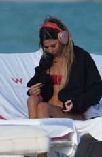 LIBBIE MUGRABI Relaxes at a Beach 12/21/2022