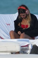 LIBBIE MUGRABI Relaxes at a Beach 12/21/2022