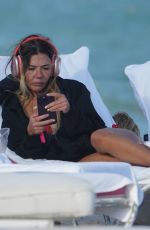 LIBBIE MUGRABI Relaxes at a Beach 12/21/2022