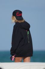 LIBBIE MUGRABI Relaxes at a Beach 12/21/2022