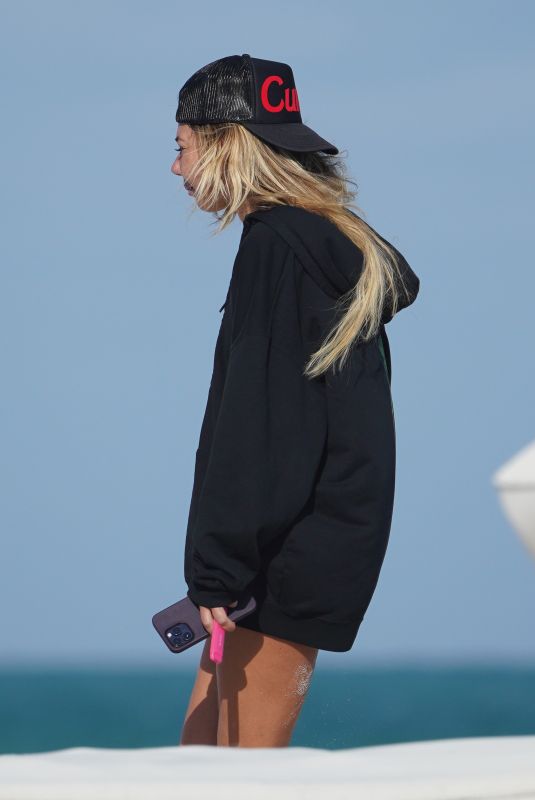 LIBBIE MUGRABI Relaxes at a Beach 12/21/2022