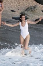 MAYA HAWKE in White Swimsuit Jumping into the Sea in St Barts 12/28/2022