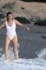 MAYA HAWKE in White Swimsuit Jumping into the Sea in St Barts 12/28/2022