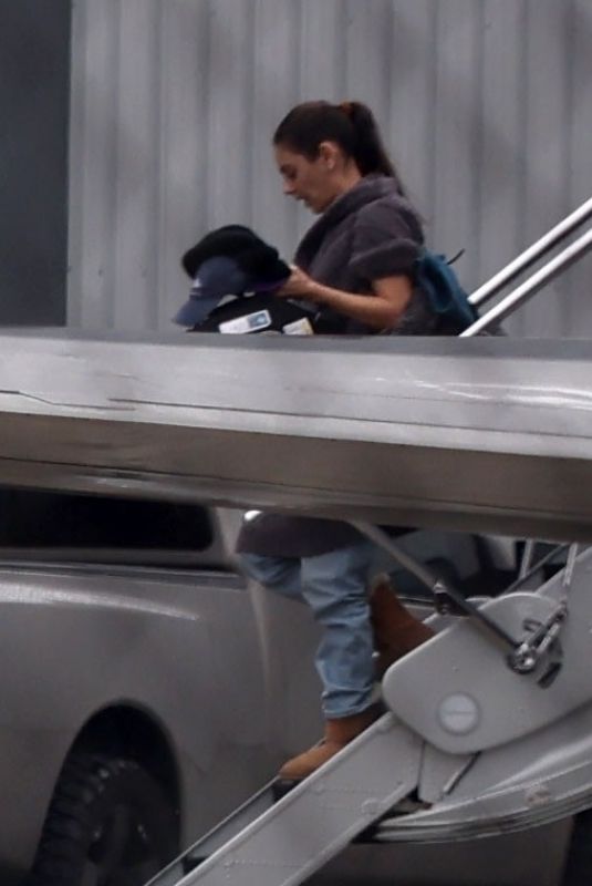 MILA KUNIS Returns Home From a Trip to Ashton