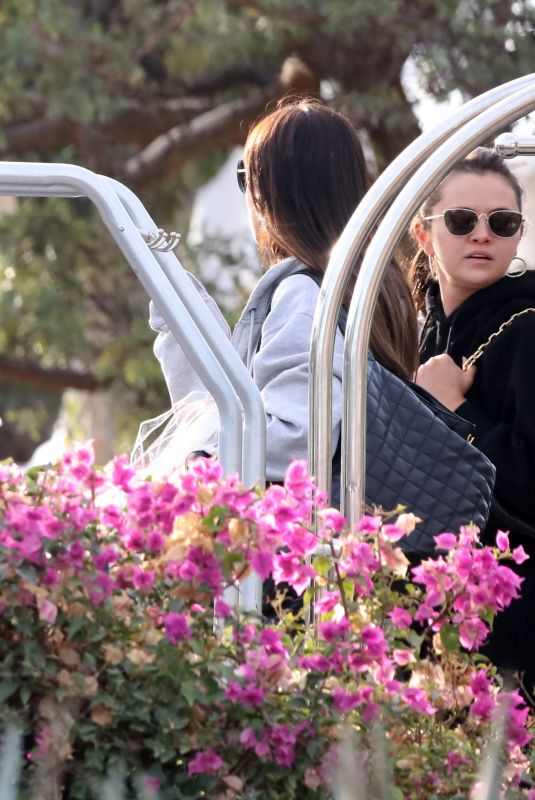 NICOLA PELTZ, Brooklyn Beckham and SELENA GOMEZ Arrives at a Private Airport in Los Cabos 12/29/2022