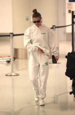 NINA AGDAL Arrives at LAX Airport in Los Angeles 12/08/2022