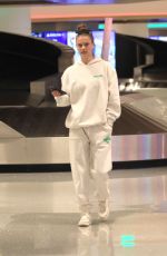 NINA AGDAL Arrives at LAX Airport in Los Angeles 12/08/2022