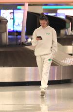 NINA AGDAL Arrives at LAX Airport in Los Angeles 12/08/2022