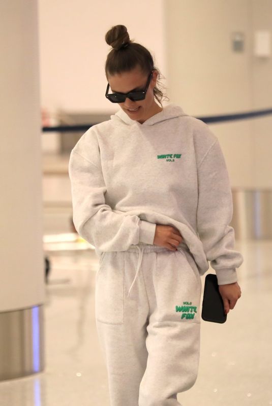 NINA AGDAL Arrives at LAX Airport in Los Angeles 12/08/2022