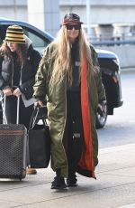 STACY FERGIE FERGUSON Arrives at JFK Airport in New York 12/01/2022