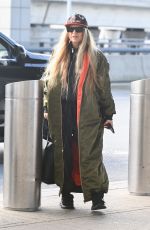 STACY FERGIE FERGUSON Arrives at JFK Airport in New York 12/01/2022