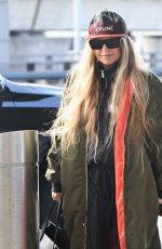 STACY FERGIE FERGUSON Arrives at JFK Airport in New York 12/01/2022
