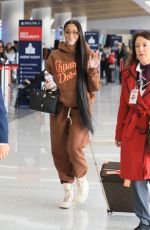 WINNIE HARLOW at Los Angeles International Airport 12/01/2022