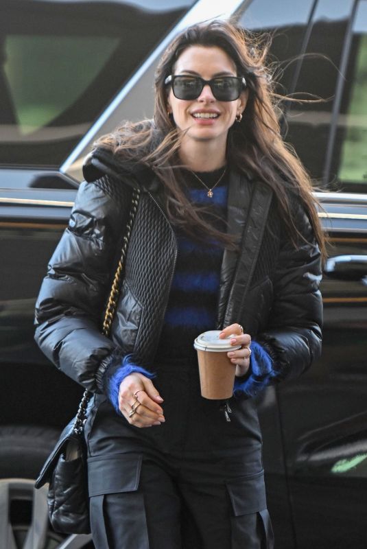 ANNE HATHAWAY Arrives at JFK Airport in New York 01/20/2023