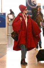 ANNE HATHAWAY Arrives at Salt Lake City Airport in Park City 01/22/2023
