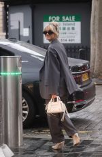 ASHLEY ROBERTS in a Grey Trouser Suit Out in London 01/04/2023