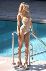 CHARLOTTE MCKINNEY at a Photoshoot at a Pool in Miami Beach 01/05/2023