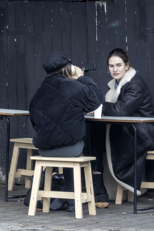 LILY JAMES Out for Coffee with a Friend in London 01/26/2023